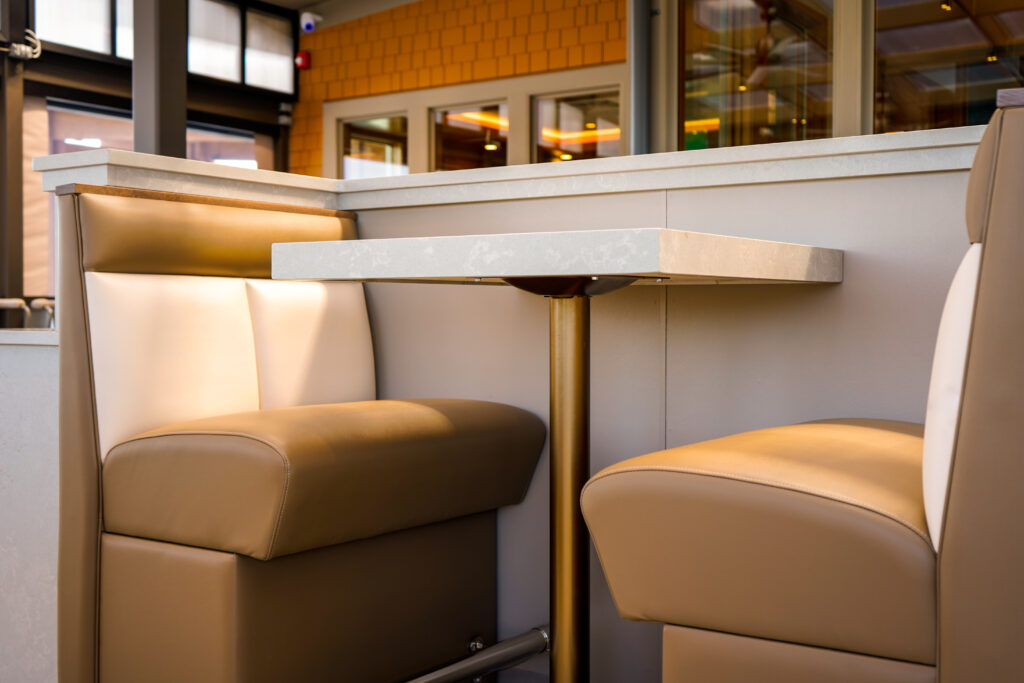 Restaurant booth with table and seating.